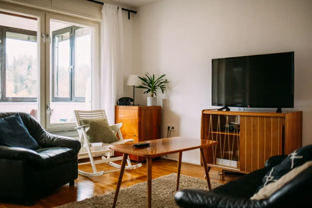 Cozy living room with a switched-off TV on a wooden stand